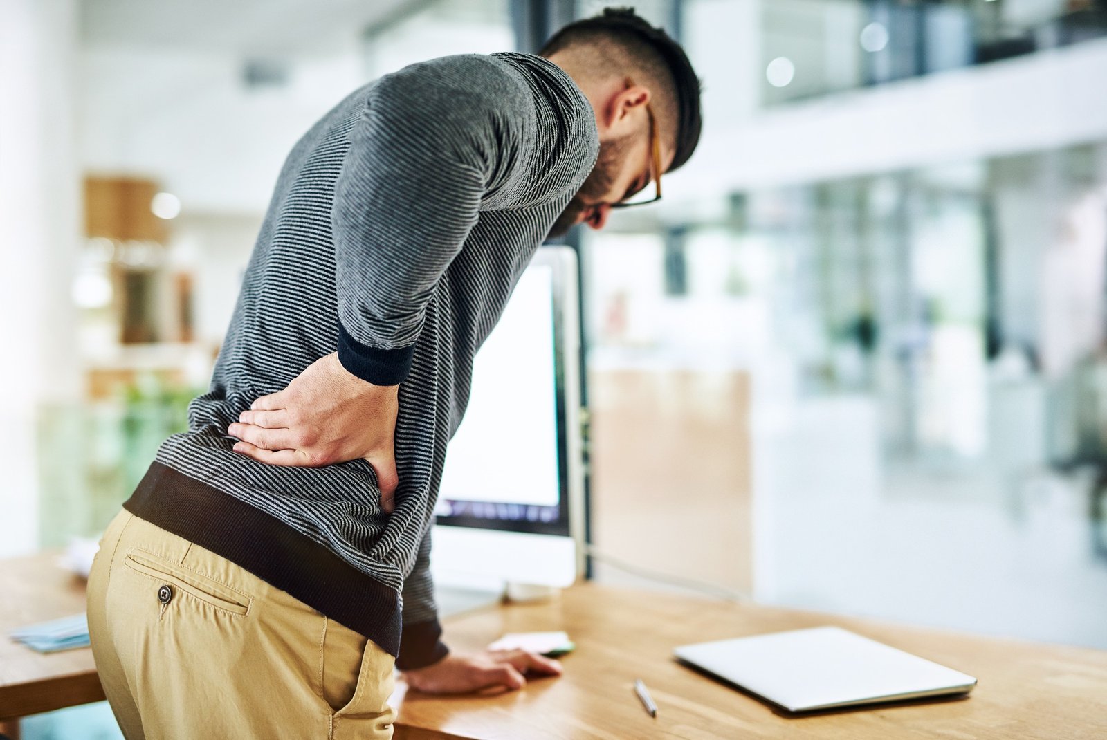 Poor posture is putting pressure on his back