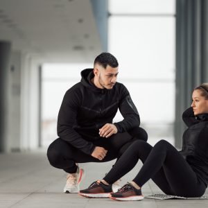 Woman having personal trainer.